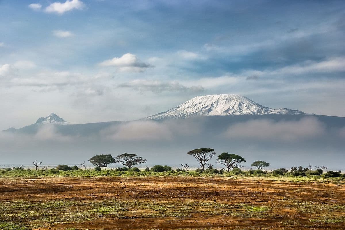 Mount Kilimanjaro rising above the acacia-dotted plains